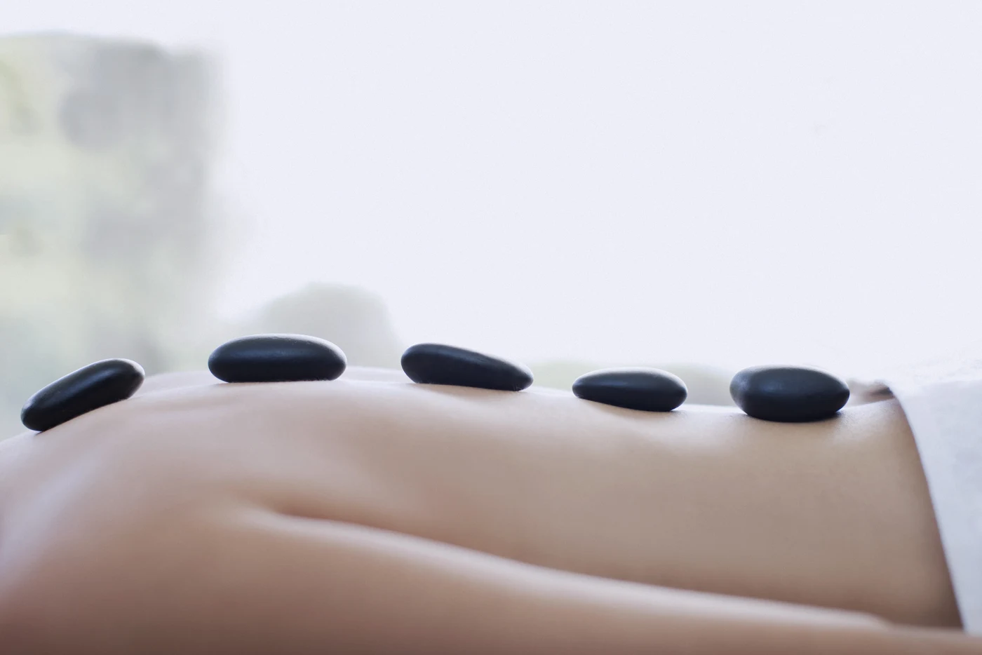 Warm massage stones arranged for a soothing treatment